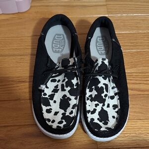 Hey Dude women’s' Black and White Cow Print Sneakers